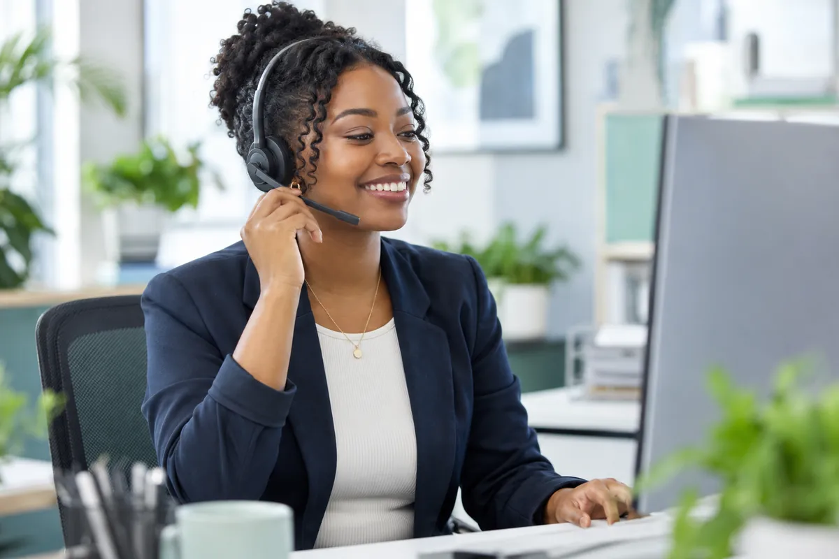 Customer service agent with a headset helping a caller with a payment plan